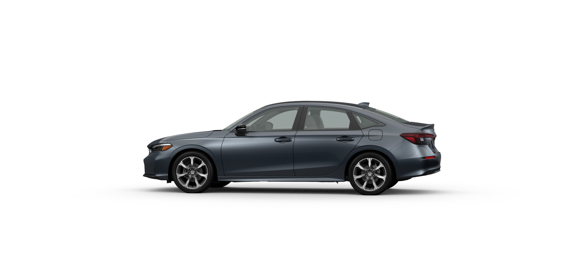 Side driver-side view of 2025 Civic Hatchback Sport Touring Hybrid in Meteoroid Grey Metallic colour on white space.