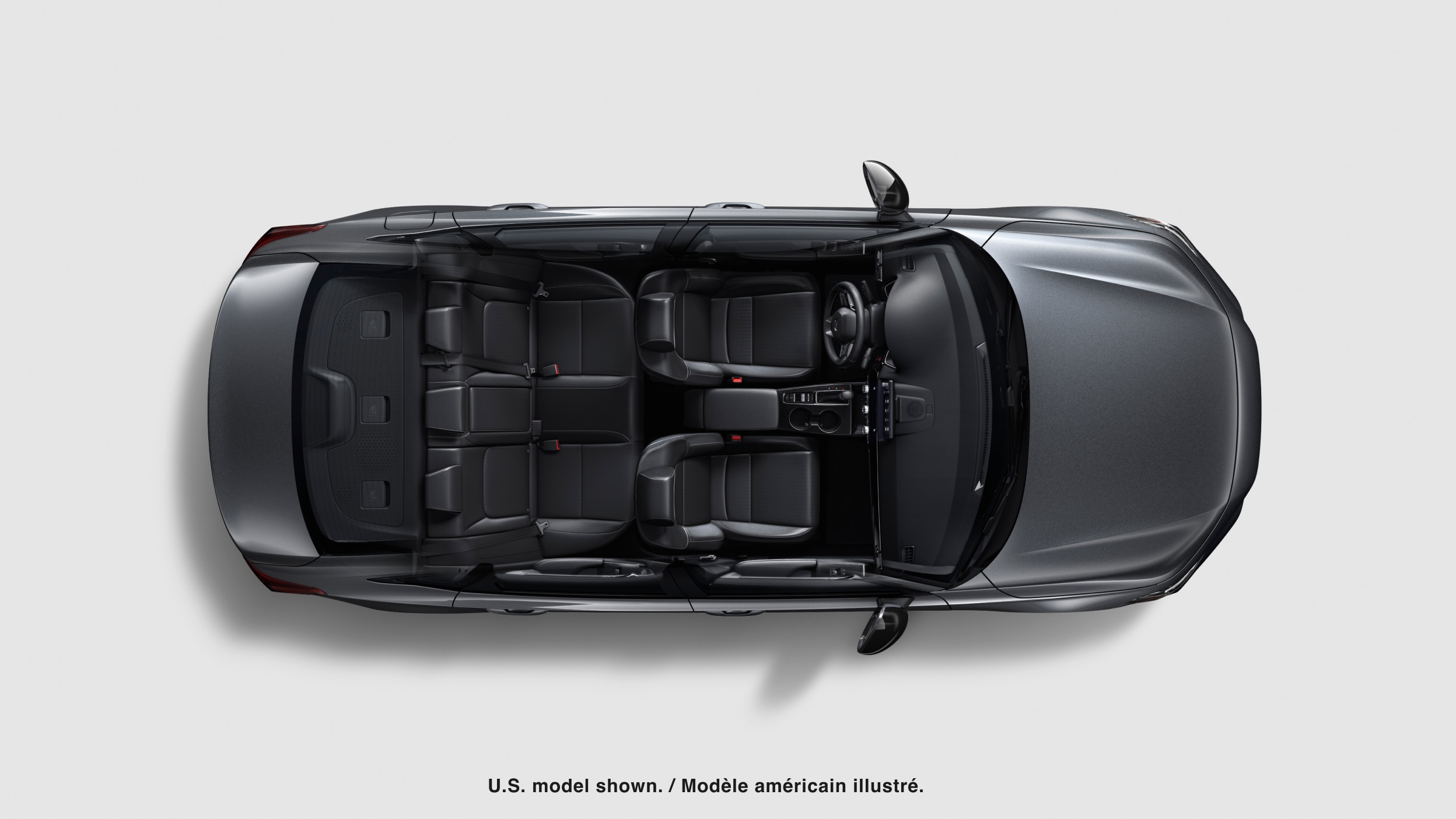 Bird’s eye view looking directly down at a grey Civic Sedan on white space with no roof, showing both rows of seating.