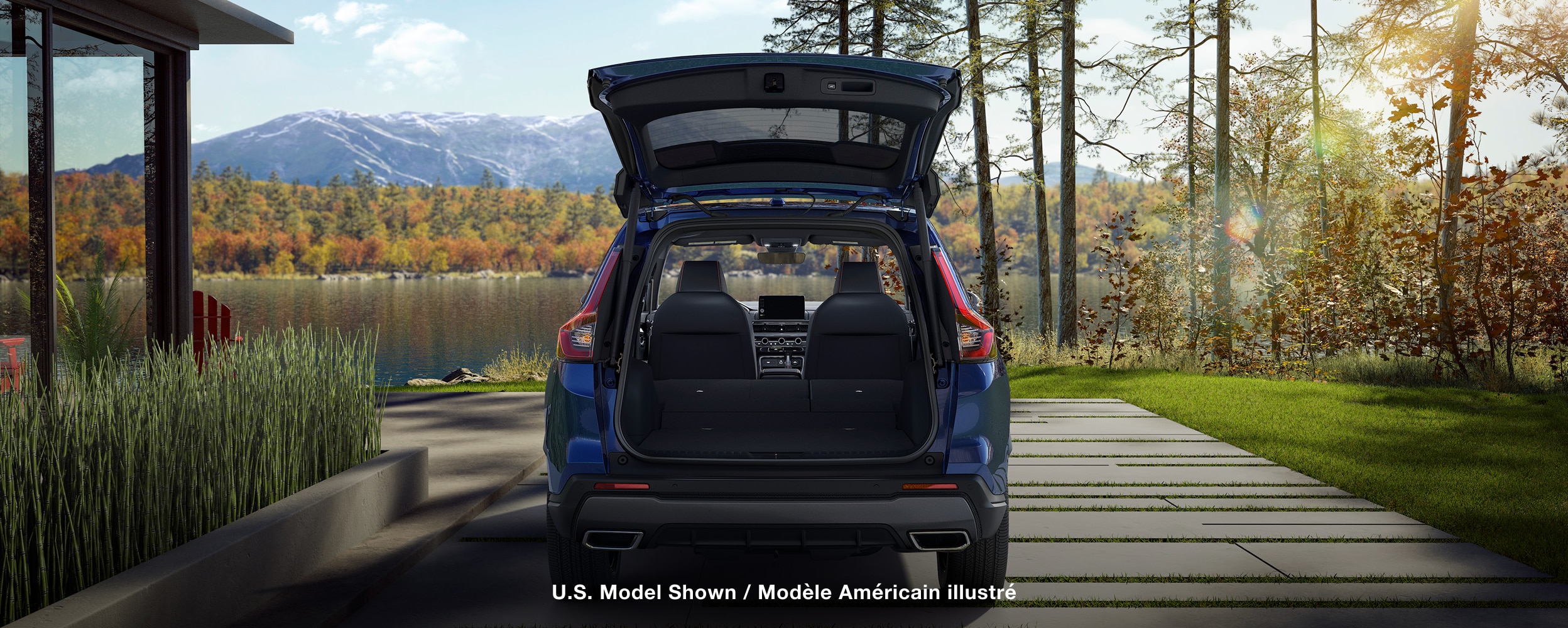 Rear view of a blue CR-V parked with tailgate door opened.