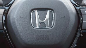 Extreme closeup of steering wheel.
