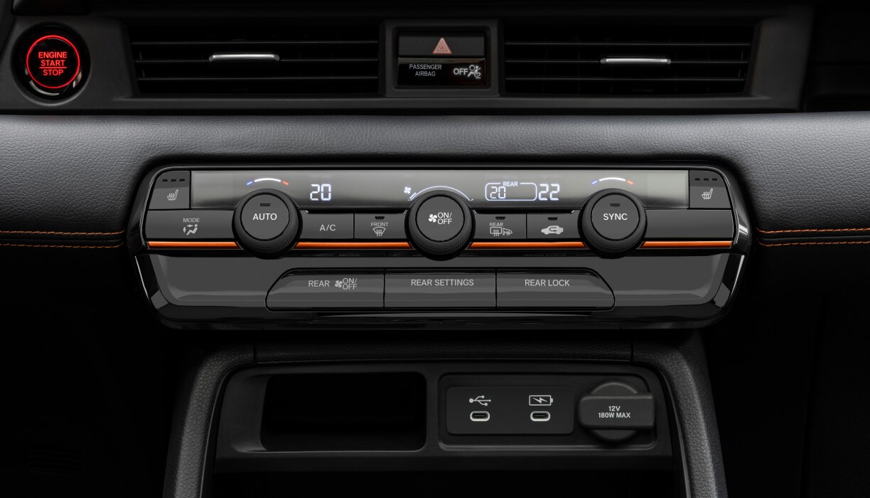 Closeup of the Pilot’s climate control panel, with buttons and dials for temperature adjustment.