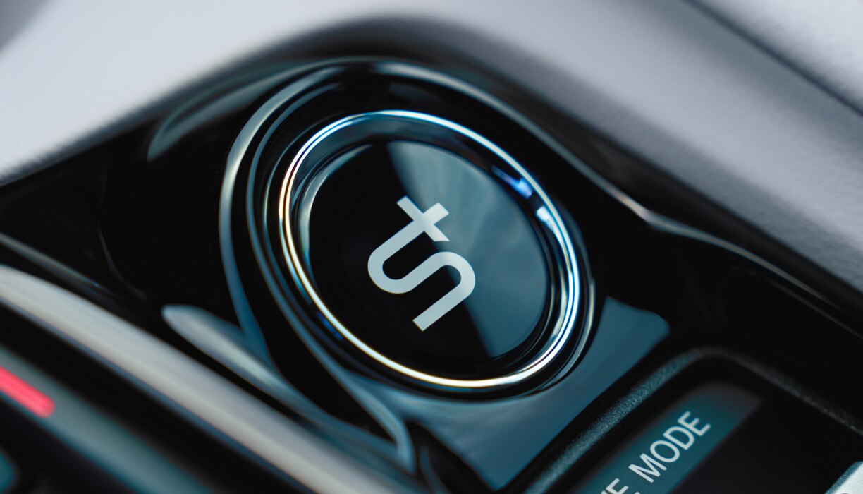 Closeup of S+ Shift System button. 