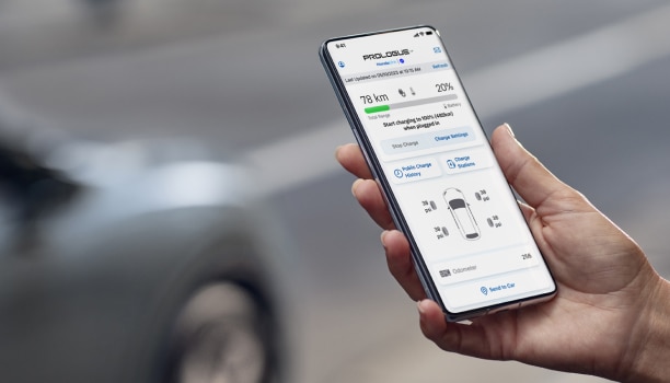 Closeup of a smartphone on white space with the HondaLink™ app interface displayed. 