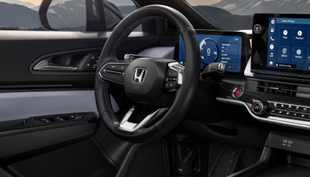 Vue de l’habitacle du Honda Prologue avec tableau de bord et volant.