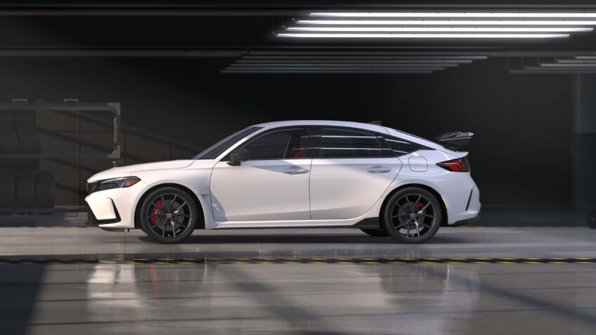 Side view of white Typr R in an auto hangar.