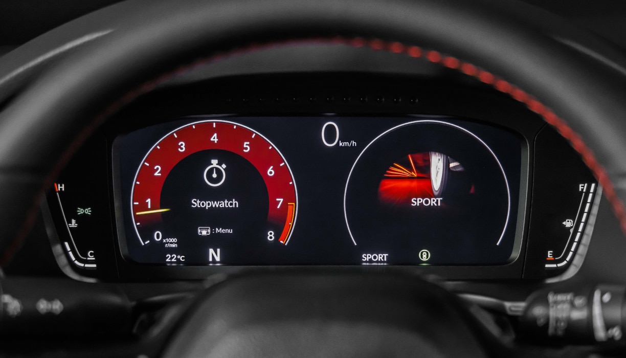 Closeup of TFT driver meter display, featuring odometer, speedometer, drive mode, etc.