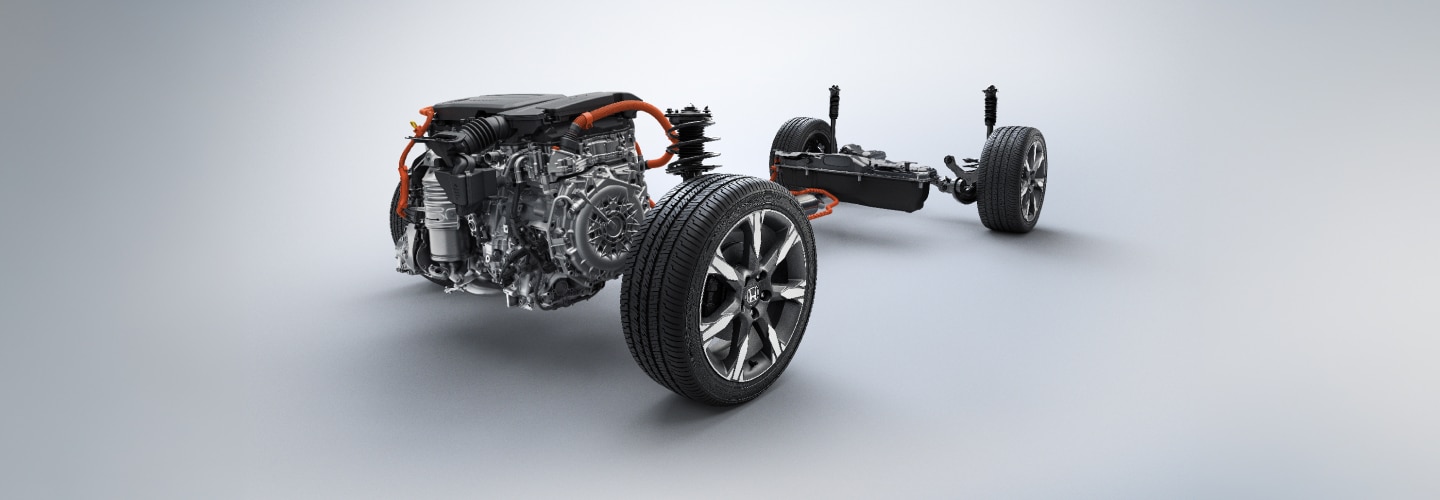 Le moteur et les roues d’un véhicule Honda illustrés sur un fond gris.
